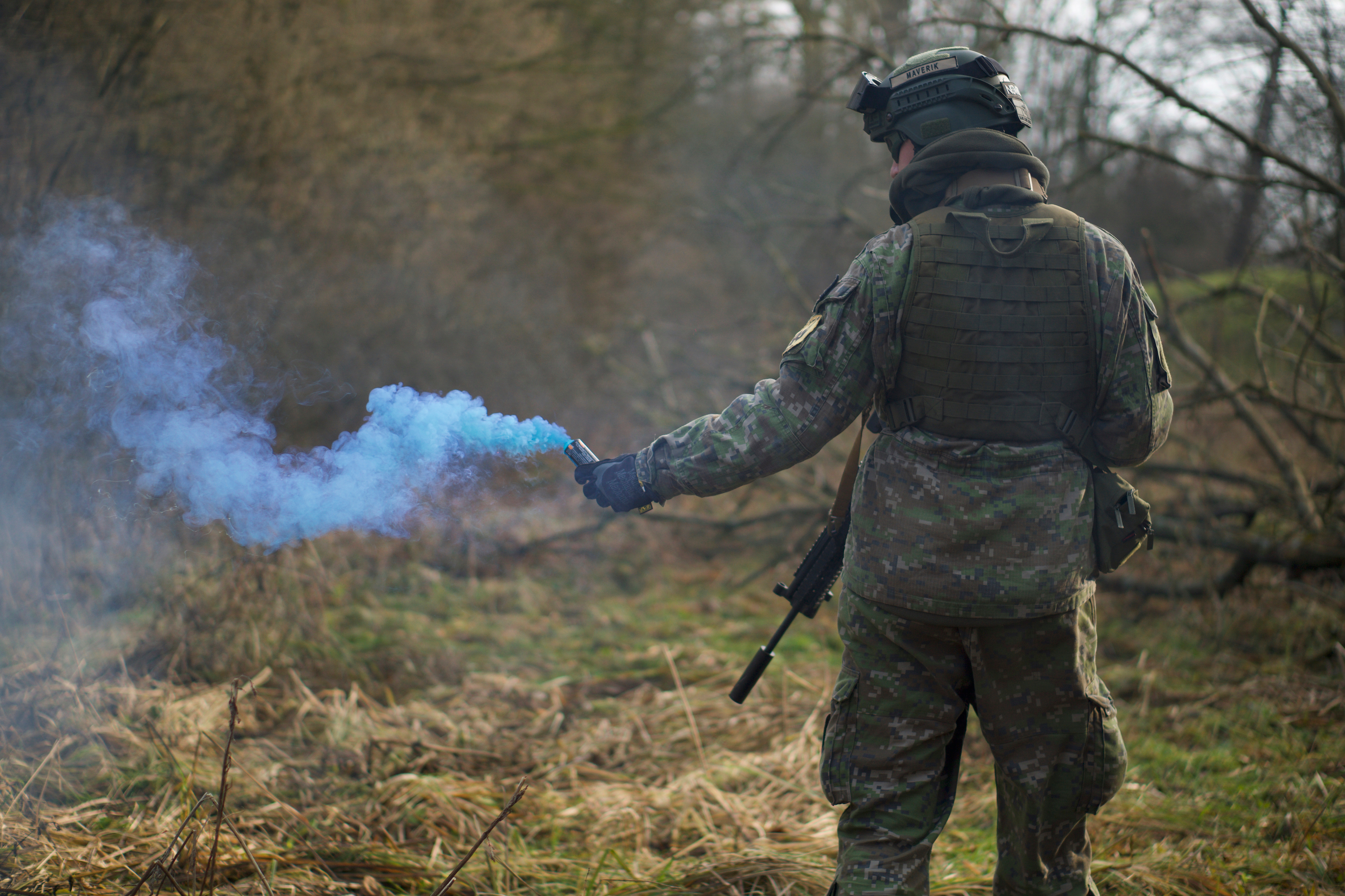 Canva - Man in Military Uniform Holding a Signal Smoke.jpg